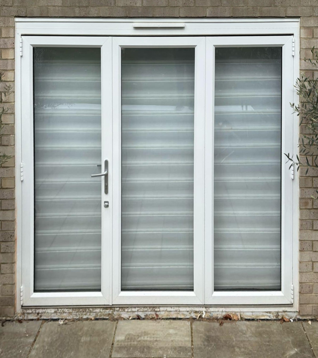 Old white stained patio doors